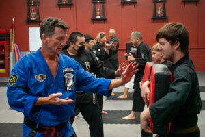 Halsey Karate Teen and Adult Classes - Scott Halsey and Students Practicing Strikes and Kicks